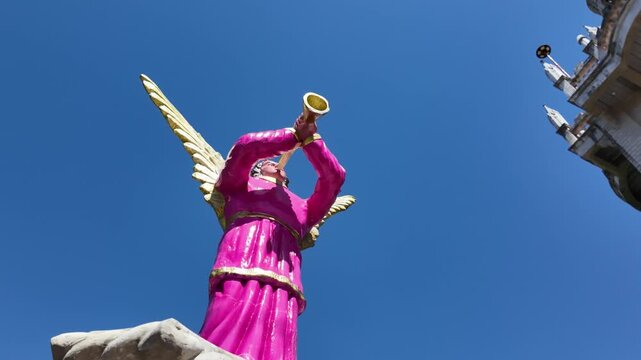Pink angel statue blowing trumpet at Simala Shrine, Cebu