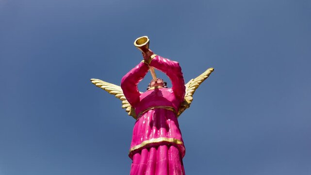Pink angel statue blowing trumpet at Simala Shrine, Cebu