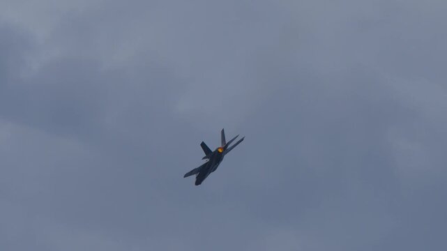 F-35 fighter jet flying with a glowing afterburner