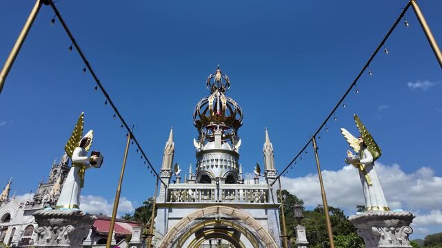 Ornate entrance gate with angel statues at Simala Shrine, Cebu