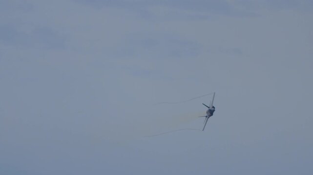 F 35 aircraft doing turns with a glowing afterburner