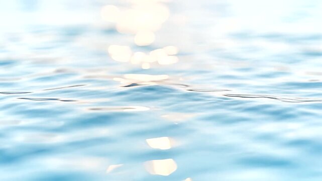 Cinematic 4K slow motion of crystal clear blue water surface with gentle ripples and shimmering sunlight bokeh