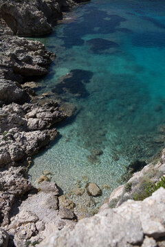 High Angle View of Crystal Clear Turquoise Water and Rocky Coastline in Corfu Island, Greece