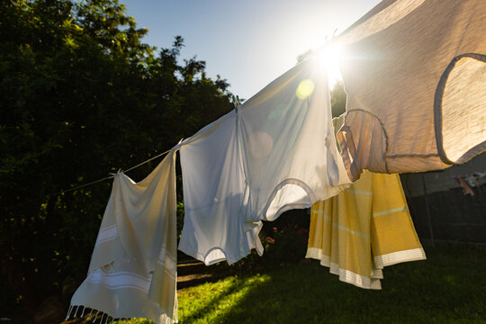 clothes on clothes line  blowing in wind early morning 