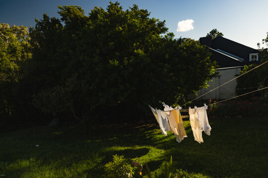 clothes on clothes line  blowing in wind early morning 