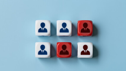 Obraz premium Team Dynamics in Transition - White and Red Dice With Human Silhouettes on Light Blue Background for HR Presentations, Corporate Restructuring Articles, and Workforce Management Concepts
