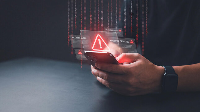 Cyber security alert on smartphone, digital data breach warning on mobile phone screen, red warning icon for system hack and online threat