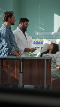 Doctor joins family near patient during mother hospital visit