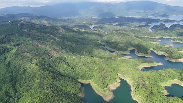 Aerial view of Ta Dung Lake with green hills in Dak Nong, central Vietnam.