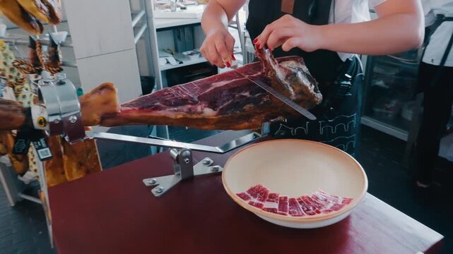 Chef Slicing Jamon Iberico Ham in Spain