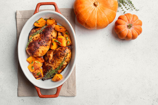 Autumn meal: roasted chicken breast and pumpkin with herbs