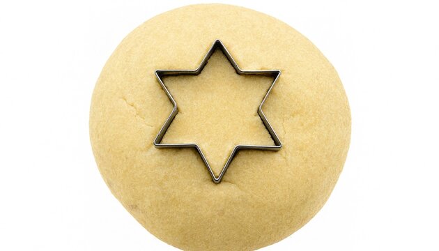 A star-shaped metal cookie cutter pressed into fresh round raw cookie dough on a white background