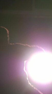 Martial arts in in front of sparklers - cheat Kick somersault in the air, slow-motion