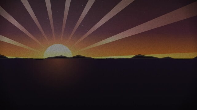 Sunrise casts retro golden beams across the sky above a dark mountain ridge