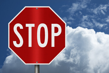 Red stop sign with sky © Karen Roach