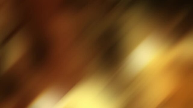 Diagonal streams of golden light move continuously across a warm defocused background in a seamless loop.
