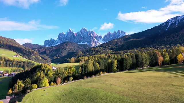 Dramatic Dolomites peaks above a peaceful alpine valley