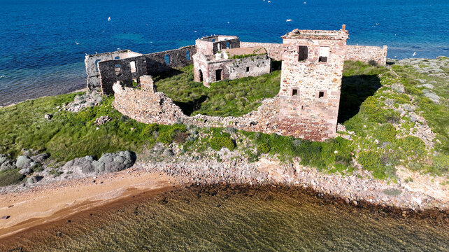 Historic ancient monastery on an island around the Patrica beach. Shooting with drone. (Turkish name; kizlar manastiri) Cunda - Ayvalik - Turkey