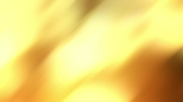 Diagonal streams of golden light move continuously across a warm defocused background in a seamless loop.