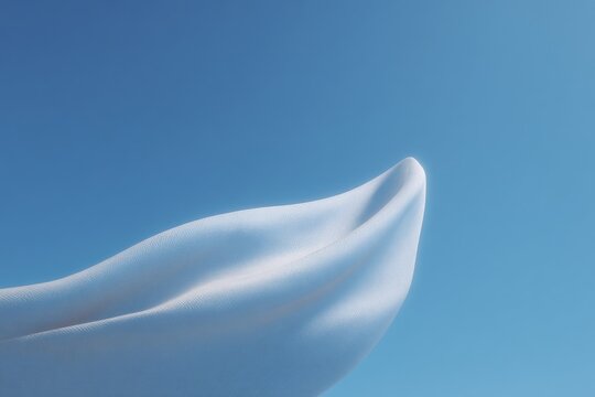 A white sculpture of a womans hand against a bright blue sky. the sculpture is made of a smooth glossy material and the sky is a deep clear blue.