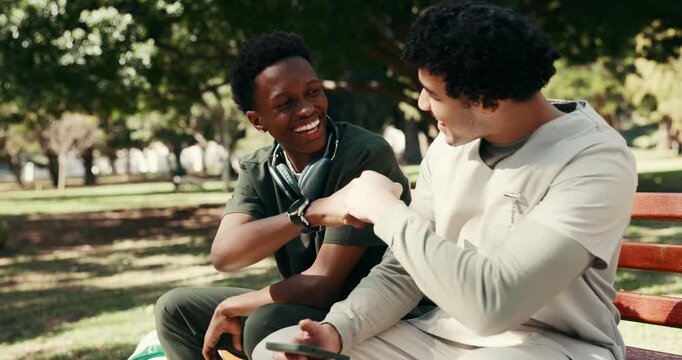 Phone, nurse and fist bump with students in park for medical entrance exam, result and support. Healthcare college, success and study schedule with men outdoor for online portal and doctor trainee