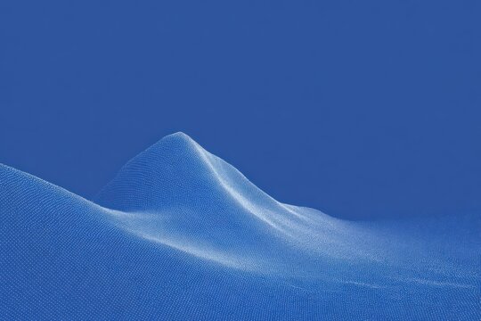 A blue sky with a mountain in the background. the sky is a deep vibrant blue and the mountain is a majestic sight. the sun is shining brightly illuminating the snowcovered landscape and creating a.