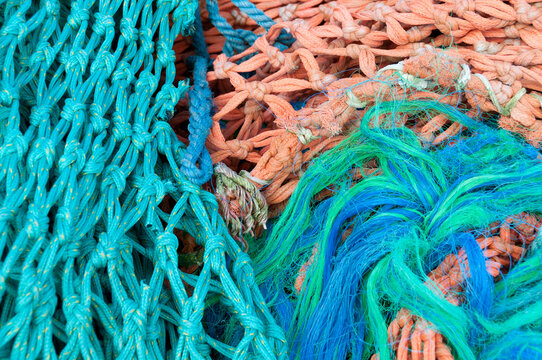 View of colorful fishing nets with intricate knots and textures in Canada.