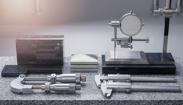 Precision measuring instruments and calibrated tools arranged for industrial quality check