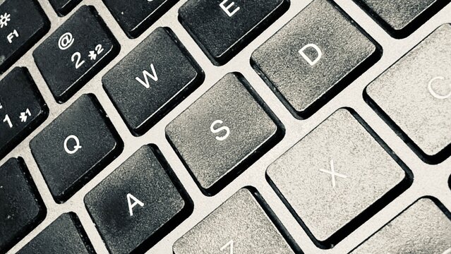 Close Up of Laptop Keyboard Keys with Black and Silver Details