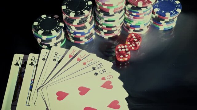 Red Dice and Playing Cards with Casino Chips in Smoke