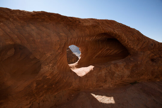 Natural Red Rock Arch Formation in Wadi Rum Desert Jordan