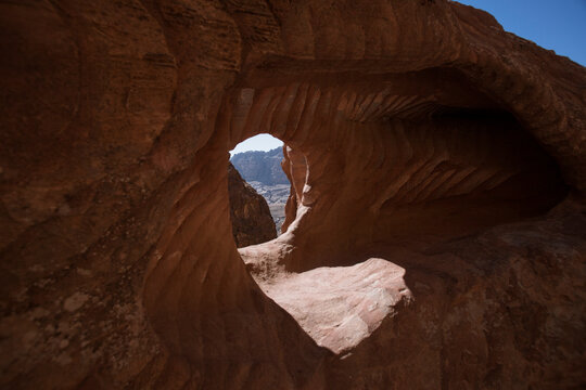 Natural rock arch formation with view opening in Wadi Rum desert Jordan