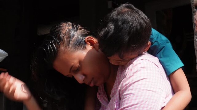 Distressed woman holding child close