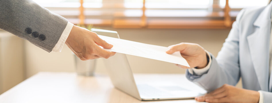 Good job, asian manager business giving financial reward in an envelope, business letter extra salary to company employee, woman worker office hand received premium bonus, getting cheque from her boss