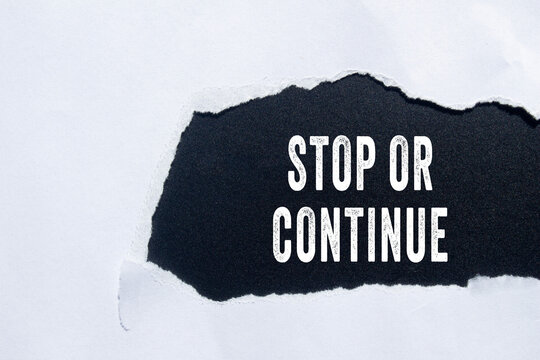 Stop or Continue text concept photo