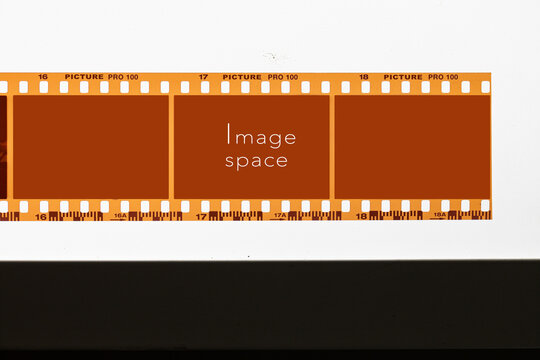 Horizontal 35mm brown film strip layout with empty photo slots and image space text on clean background.