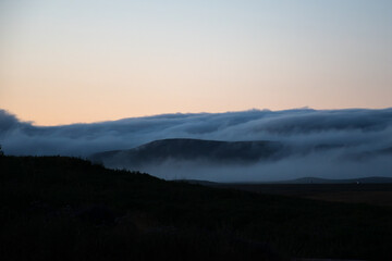 Obraz premium Misty Icelandic Mountains and Rural Landscape