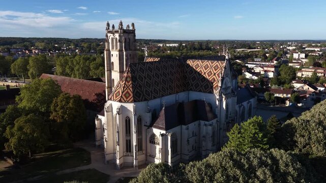 Aerial Gothic monastery with patterned roof in Bourg-en-Bresse