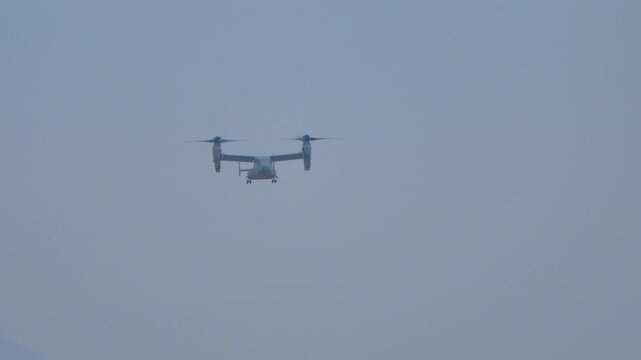 Osprey aircraft doing a vertical propeller flight