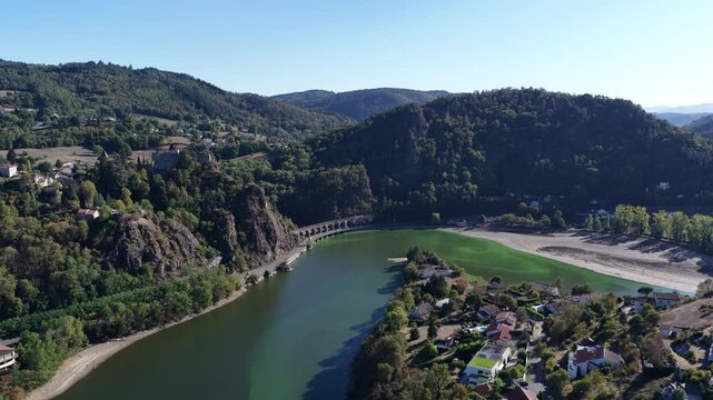 Aerial Loire gorge castle bridge and low green reservoir