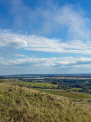 Fototapeta premium Rolling Green Hills and Dramatic Blue Sky in Ukrainian Countryside