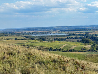 Obraz premium Rolling Green Hills and Dramatic Blue Sky in Ukrainian Countryside