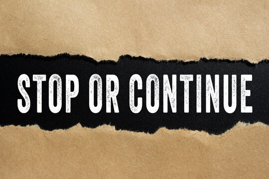 Stop or Continue text concept photo