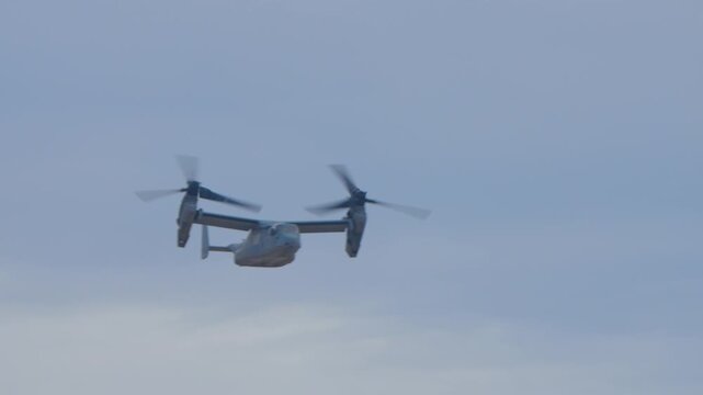Osprey military plane flying with vertical propellors