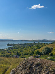 Obraz premium Rolling Green Hills and Dramatic Blue Sky in Ukrainian Countryside
