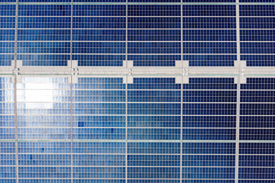 Detailed view of blue solar panel array grid
