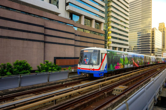 Bangkok, Thailand - June  16, 2026 : BTS Skytrain is entering Chong Nonsi Station, passing the skywalk, which is a check-in point in Bangkok, Thailand.