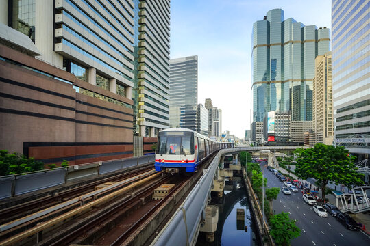 Bangkok, Thailand - June  16, 2026 : BTS Skytrain is entering Chong Nonsi Station, passing the skywalk, which is a check-in point in Bangkok, Thailand.