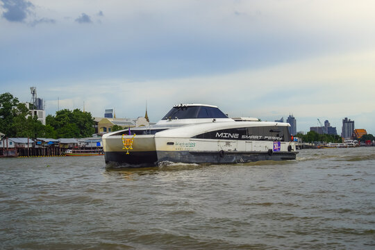 Bangkok, Thailand - June  16, 2026 : Electric passenger boats operating on the Chao Phraya River during the daytime.