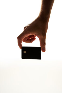 Hand Holding Blank Black Credit Card on White Background